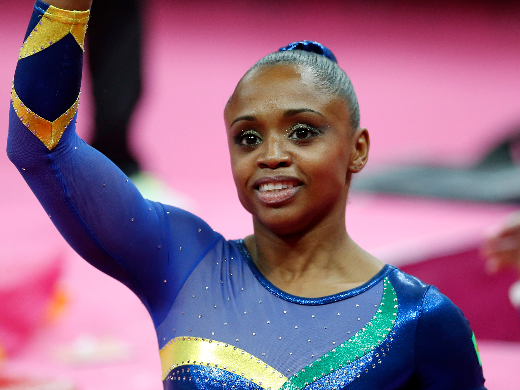 London Olympics Artistic Gymnastics Women --- Brazilian gymnast Daiane dos Santos clenches her fist after her uneven bars exercise during the artistic gymnastics women's qualifications at the 2012 Summer Olympics, Sunday, July 29, 2012, in London.